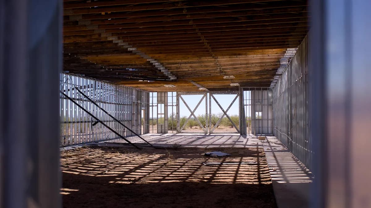 Sunlit interior with exposed wall and ceiling framing