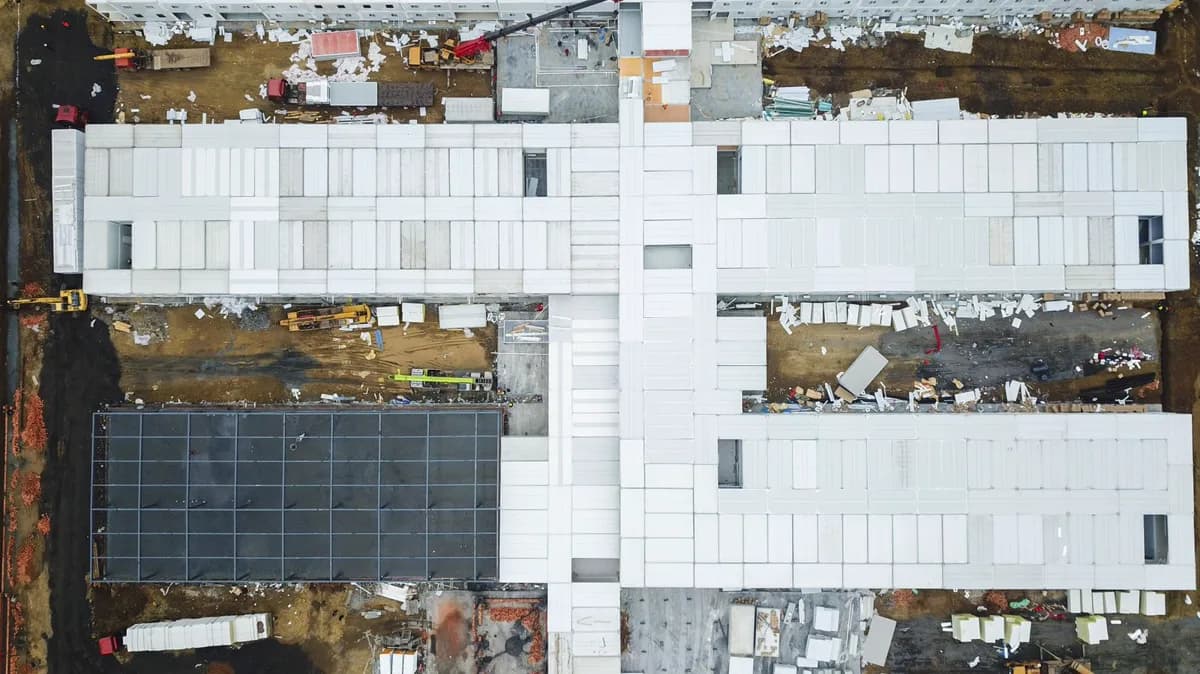 Overhead view of a multi-wing building under construction